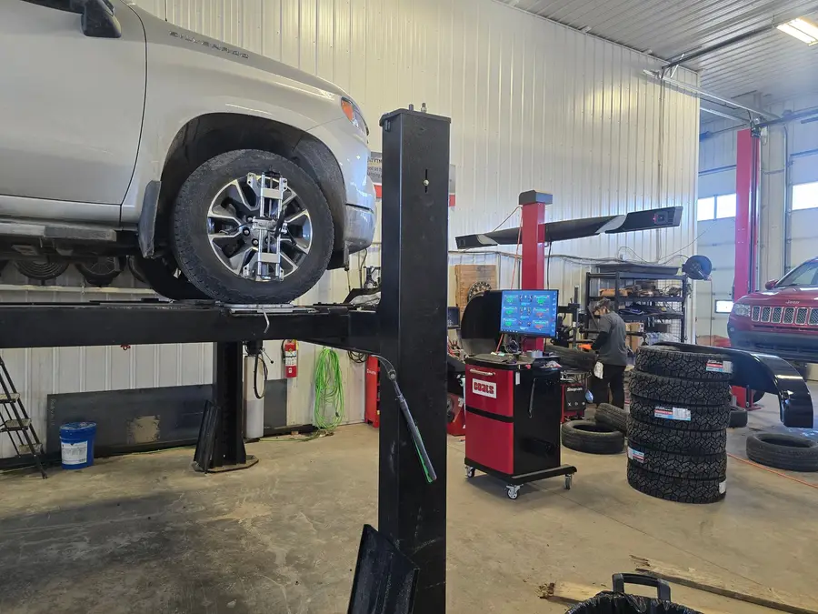 Truck on the alignment rack with wheel sensors attached