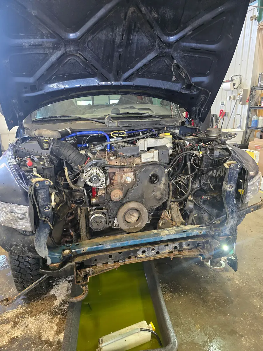 Close-up of an engine bay being inspected