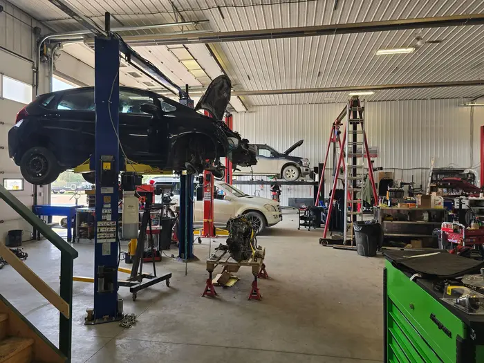 Vehicles on lifts in the service bays
